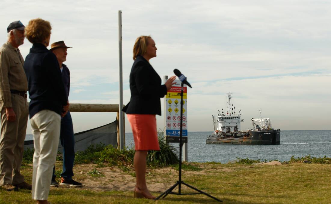 Shipping News: Lord Mayor Nuatali Nelmes speaks at a press conference at Stockton on Wednesday. The David Allan vessel, which dredges in the Port of Newcastle, floats in the background. Picture: Jonathan Carroll 