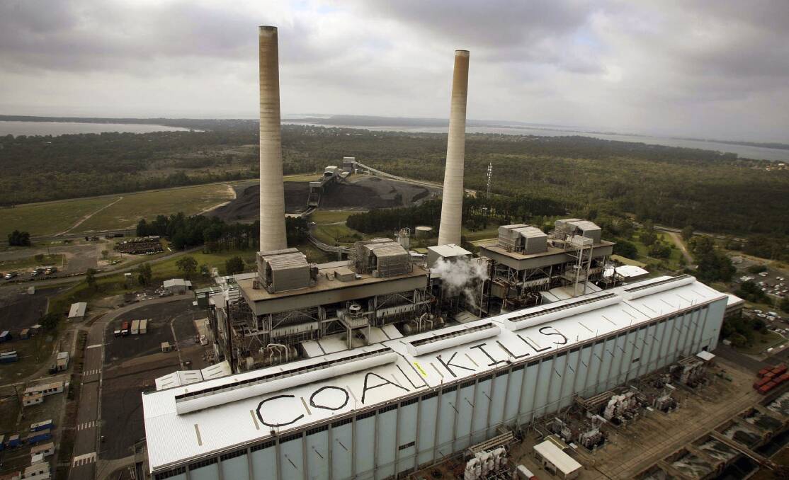 Protest: Greenpeace members climbed onto the roof of Munmorah coal-fired power station in 2007 to deliver this anti-coal message to then prime minister John Howard.  