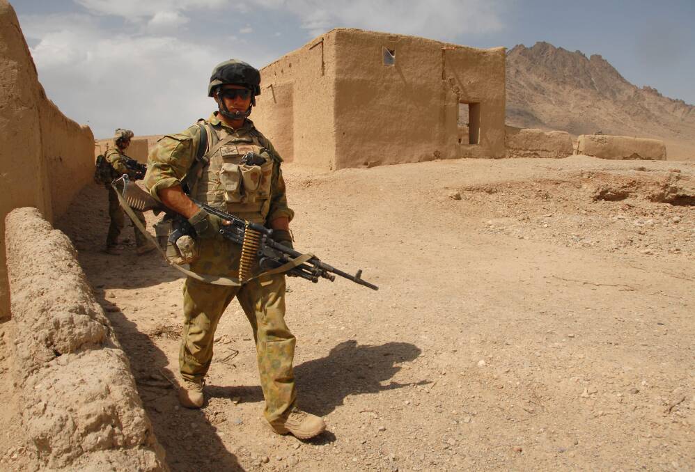 Stay Alert: Australian soldier Private Thomas Saunders on patrol in the Baluchi Valley, Afghanistan. Picture: Corporal Neil Ruskin 