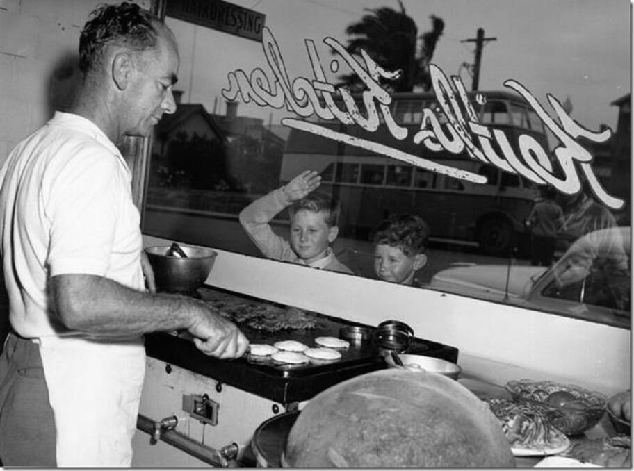 Burger Joint: Joe Wellings cooking burgers on the grill at Keith's Kitchen, as salivating youngsters look on. 