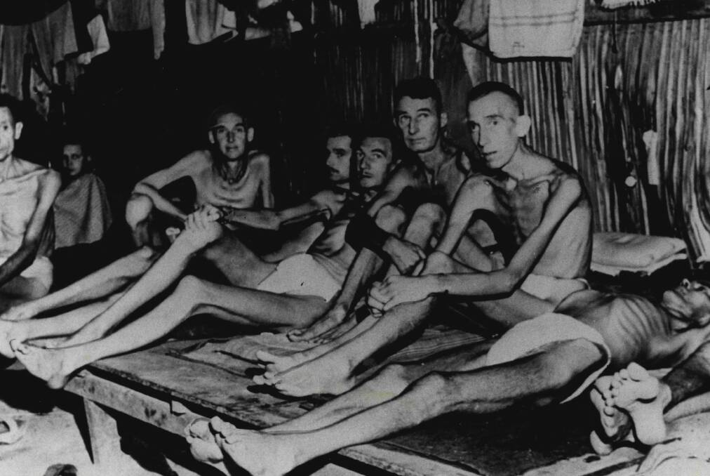 Emaciated prisoners of the Japanese at the notorious Changi POW camp in Singapore in World War II.   