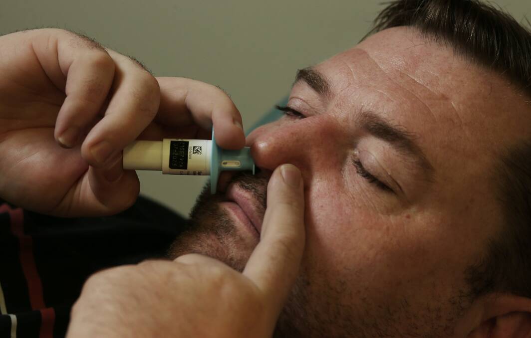 Treatment: Justin Scanlon self-administering esketamine nasal spray. Picture: Simone De Peak 