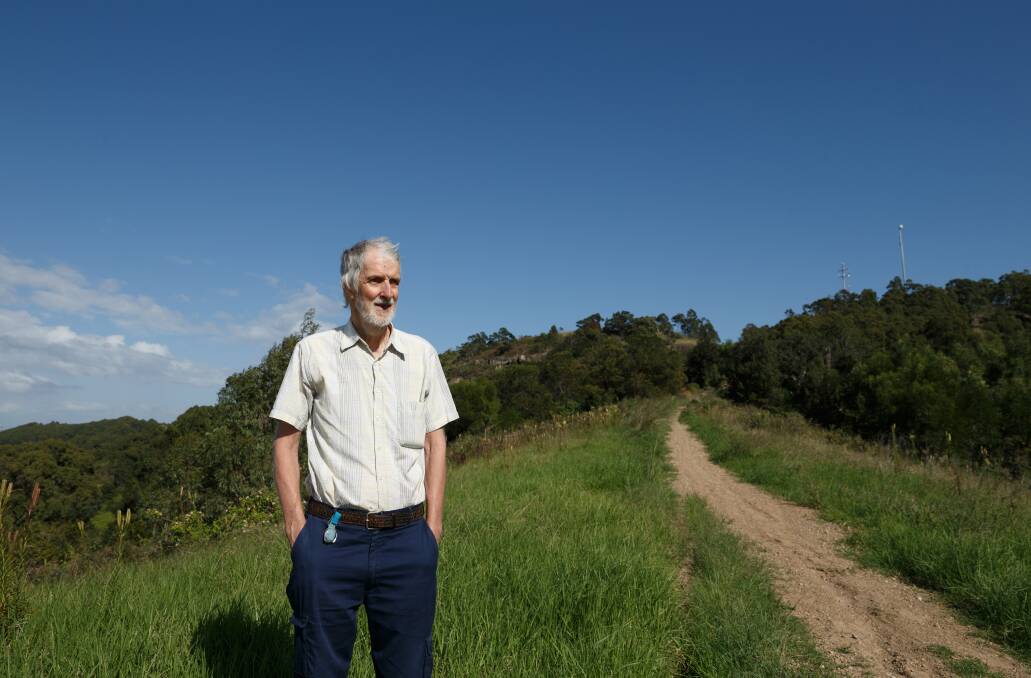 Hilltop: Munibung HIll Conservation Society president Stuart Carter on a ridge on the hill's north-east. Picture: Max Mason-Hubers 