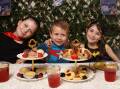 Luca Nelson, 3, and sisters Ella, 9, and Mia, 7, enjoyed a tea party for the Supertee cause. Picture by Peter Lorimer    