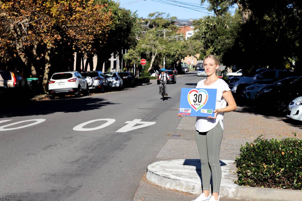 Slow Down: Kiani Cooper, a Newcastle resident, supports calls to reduce residential road speeds to 30km/h, especially near schools. Picture: Steven Fleming 
