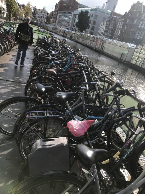 Bikes parked on a barge in Amsterdam. 