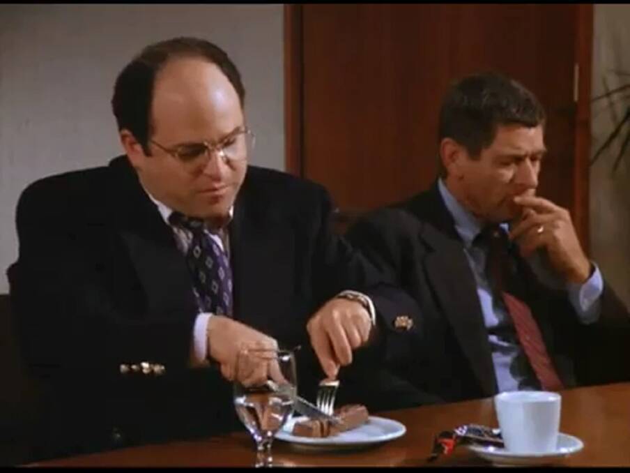 Civilised: George Costanza eating a Mars Bar with a knife and fork. Hamburgers can also be eaten this way. 