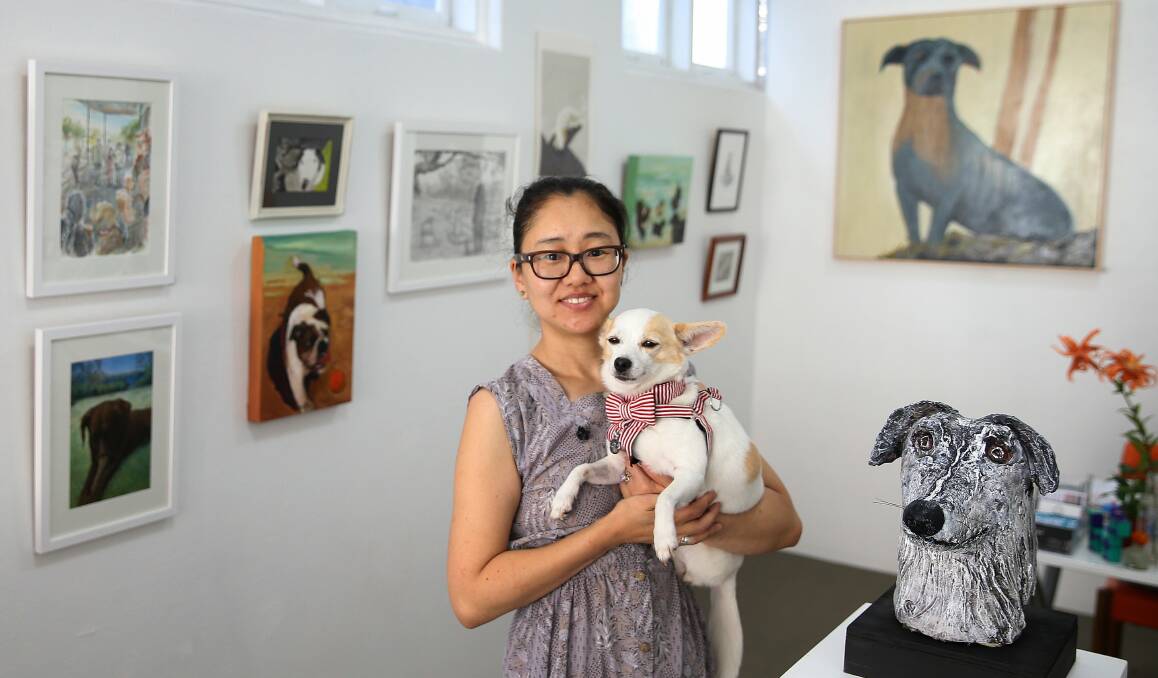 Top Dog: Ahn Wells and her dog Coco at Gallery 139 in Hamilton. Coco inspired the latest exhibition at the gallery, titled Dogs in ART. The exhibition features 61 works. Picture: Marina Neil.
