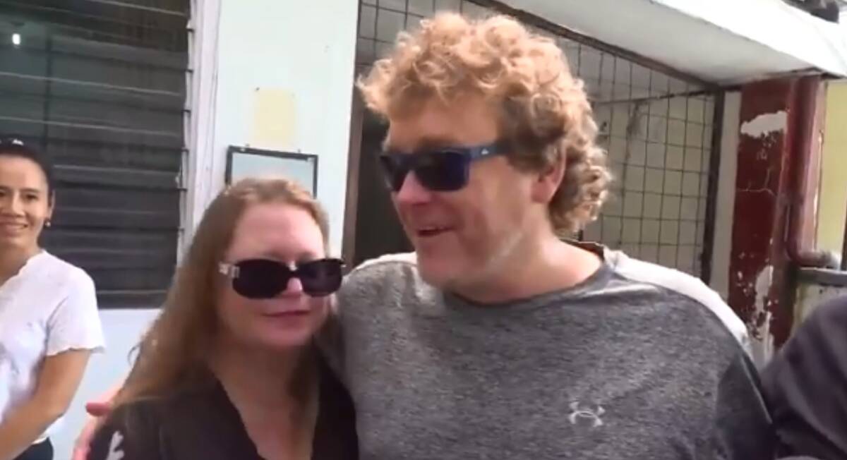 Freed: Michael Petersen greets his wife Linda after his release from police detention in Bali. Picture: Nine News. 