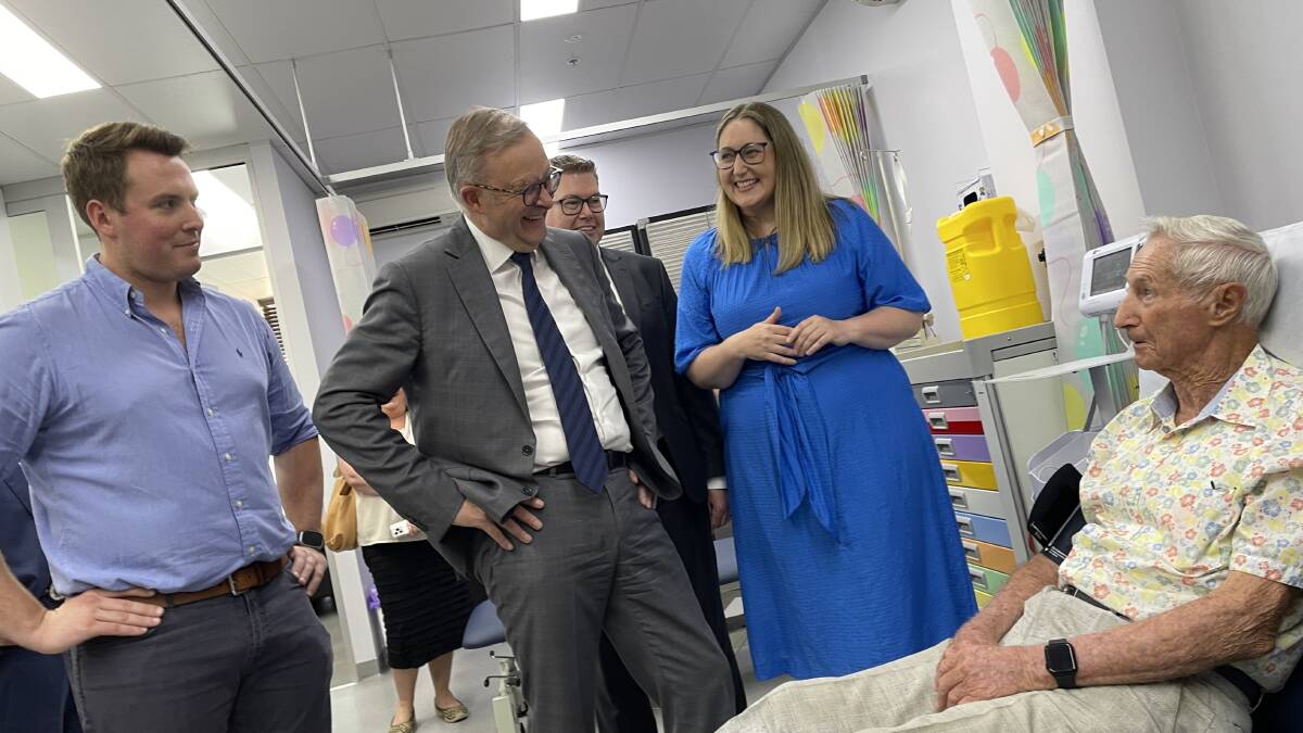 Prime Minister Anthony Albanese at a bulk-billing clinic at Lake Haven on Friday with patient Tom Laidlaw and fellow MPs. 