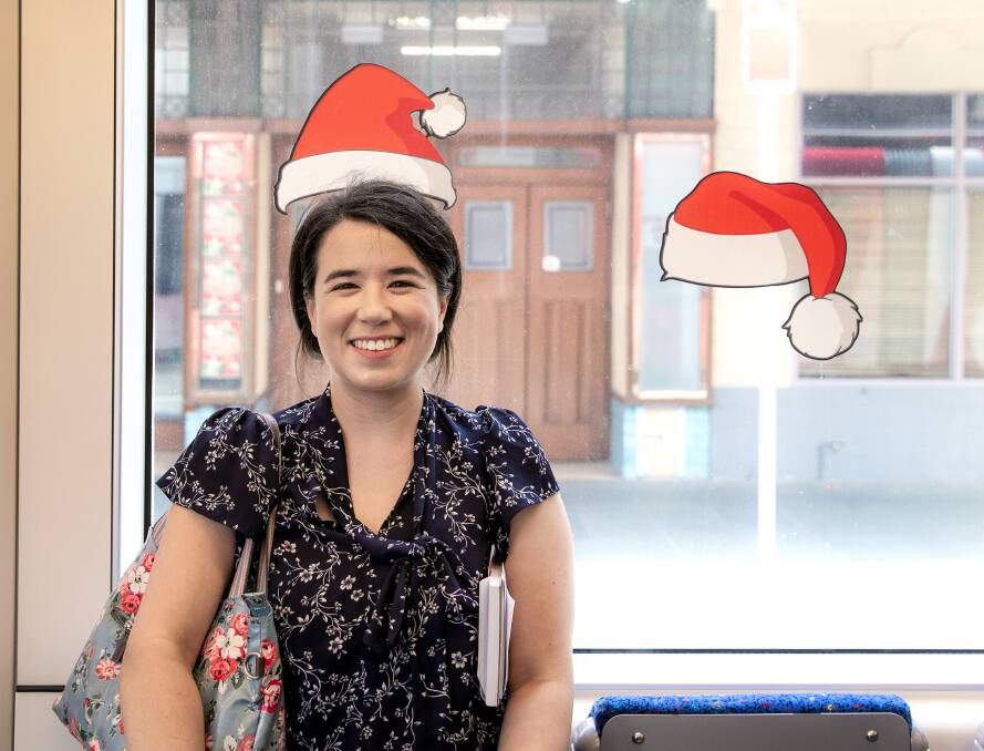 Herald journalist Helen Gregory gets in the festive spirit on a Newcastle tram. 