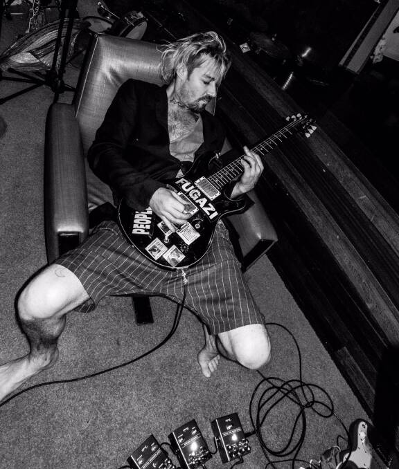 Electric Dreams: Daniel Johns posted this photo of himself playing an old guitar, prompting speculation about his next move. Picture: Luke Eblen 