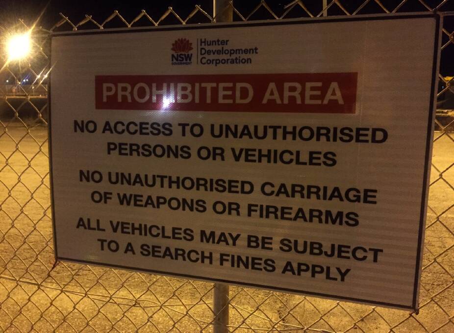 A sign at Honeysuckle that makes it very clear that weapons aren't allowed. 