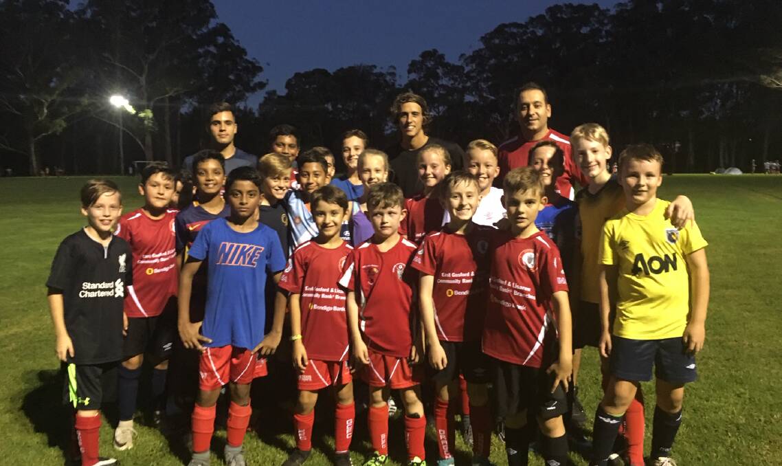  Lachlan Wales (centre at rear) with Gosford FC players a few years ago. 