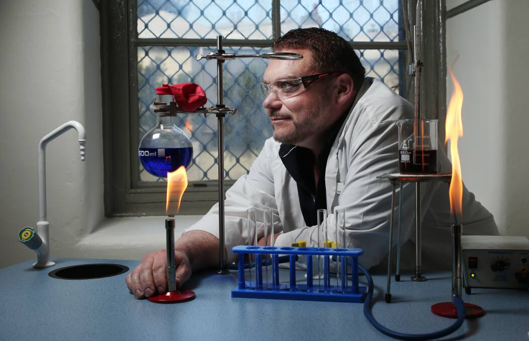 Scientific: Andrew Beaton, a science teacher at Alesco Senior College, prepares to conduct an experiment using a 'mobile science bench'. Picture: Simone De Peak 