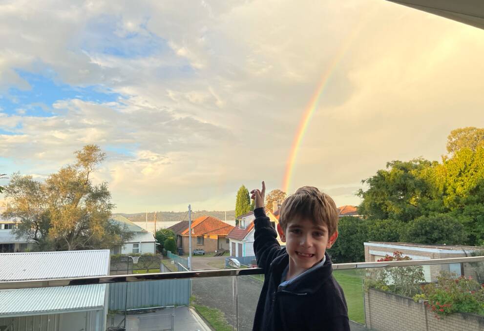 Up There: Andrew Cadet, 8, points to where he spotted a UFO at Carey Bay. It looked like a "shiny small bright white sphere". 