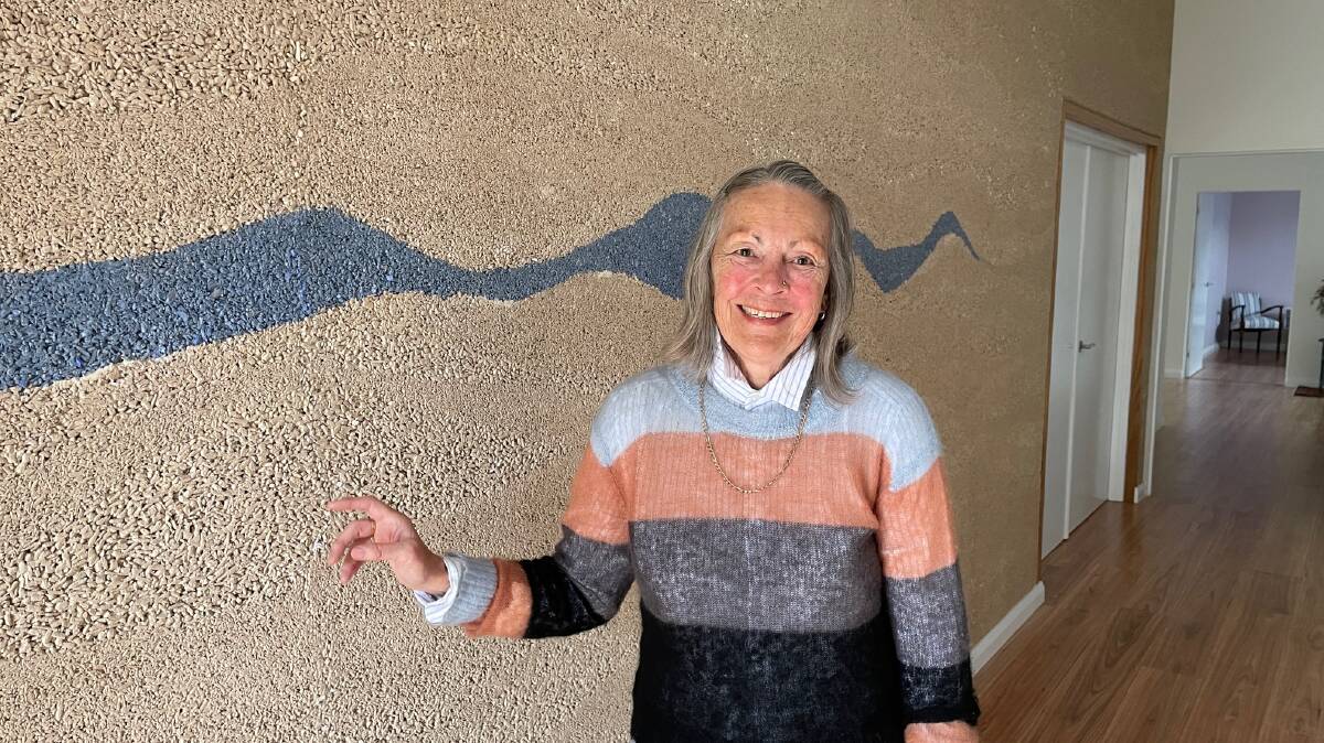 Sue Wynn with hemp walls that she used in her renovated house at Mannering Park. Picture by Damon Cronshaw 