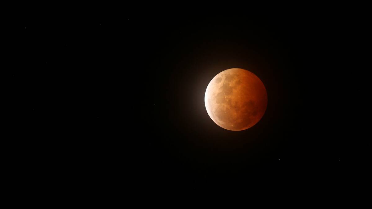 Over the Moon: A total lunar eclipse - also known as a blood moon - over Newcastle in 2014. Picture: Max Mason-Hubers 