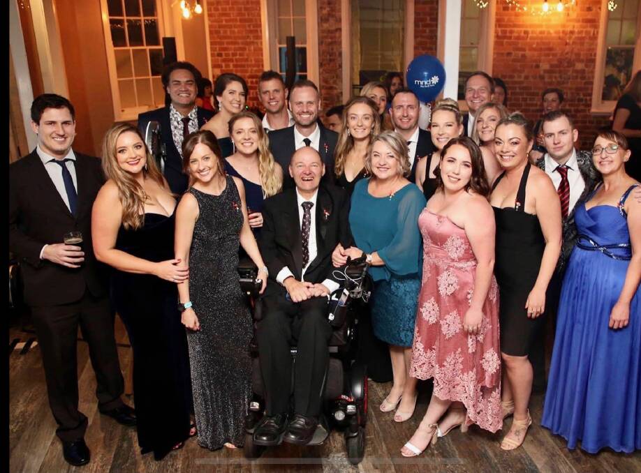 Andrew and Jen Barrett with supporters at the Team Barrett MND Ball in 2021. Picture supplied 