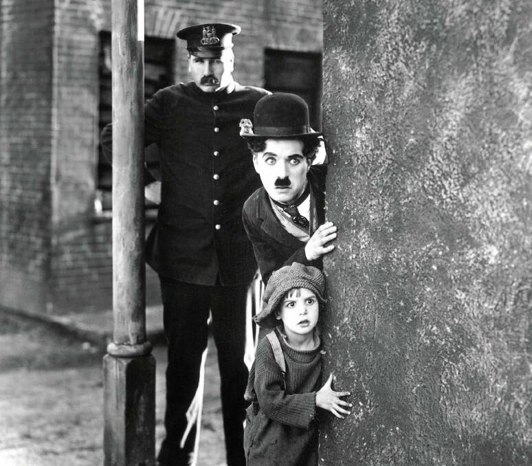 A scene from Charlie Chaplain's The Kid. 