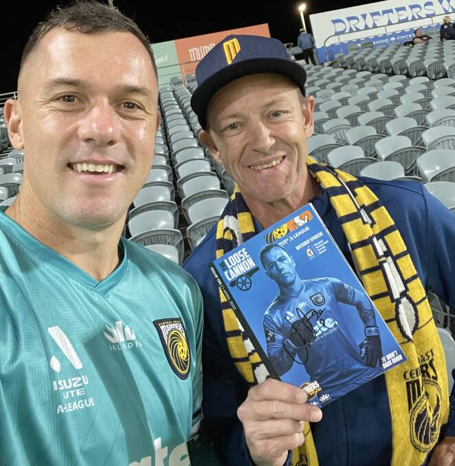 Mariners fan and club volunteer Erin Morrow (right) with the team's goalkeeper Danny Vukovic. Picture supplied 