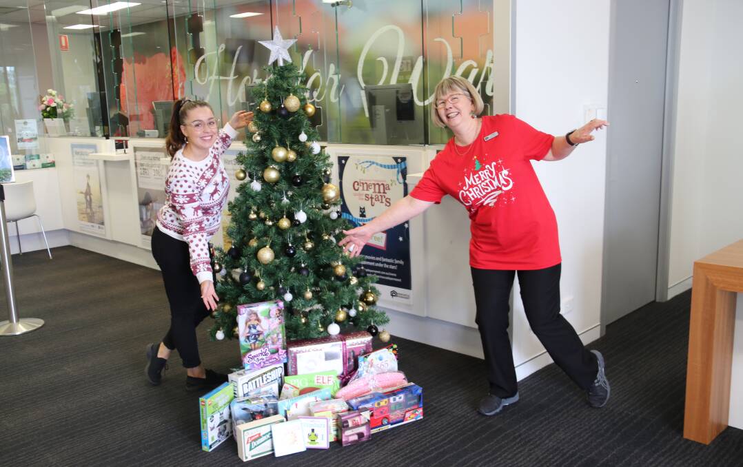Gift of Giving: Newcastle Permanent's Stefani Dupesovski and Lynn Bookless get into the spirit of the Salvos Christmas Appeal. 