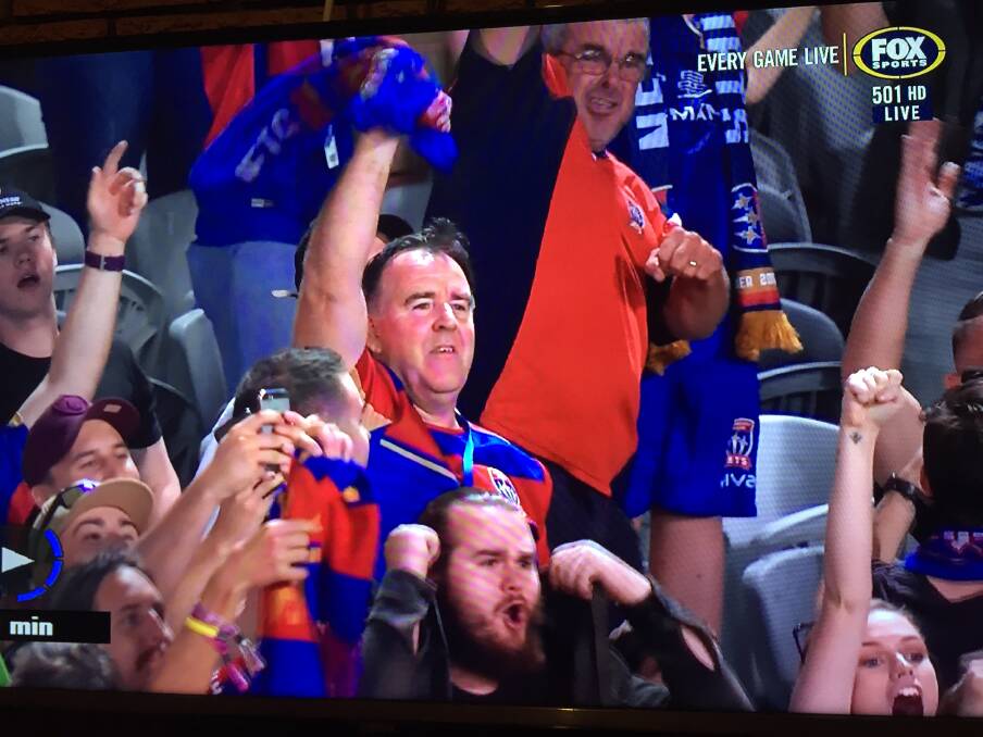 Man of the People: Newcastle Jets general manager Lawrie McKinna shown on Fox Sports among fans several years back. 
