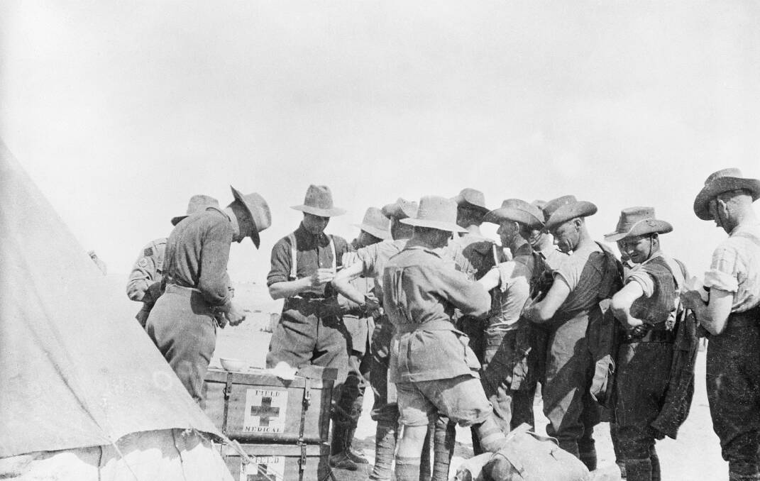Jabbed: Australian Infantry soldiers of the 21st Battalion receiving cholera vaccinations in Egypt in 1915, prior to leaving for Gallipoli. Picture: Australian War Memorial 