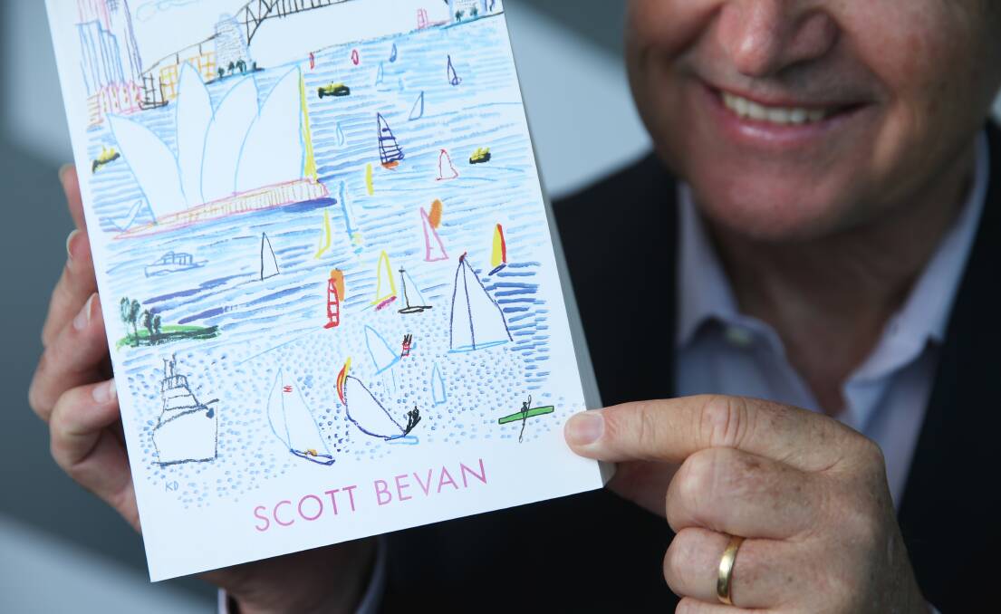 Up Close: Scott Bevan points to the kayaker on his book cover.