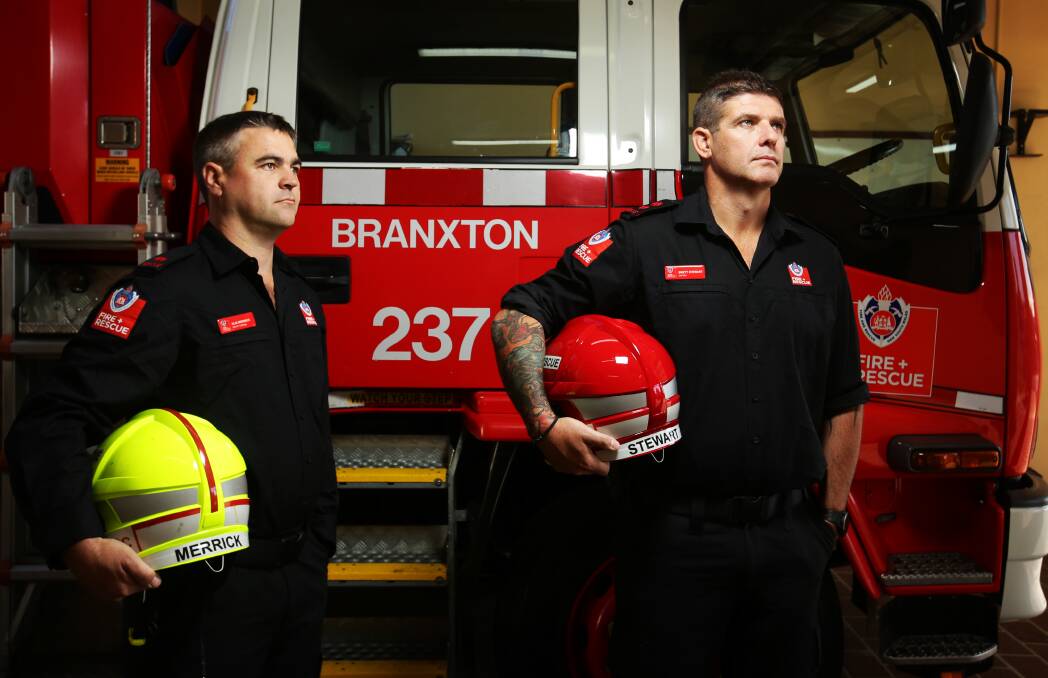 Deputy Captain Alix Merrick and Captain Brett Stewart, of Branxton Fire and Rescue NSW, with a vehicle they took to the scene of the Greta bus crash. Picture by Simone De Peak 