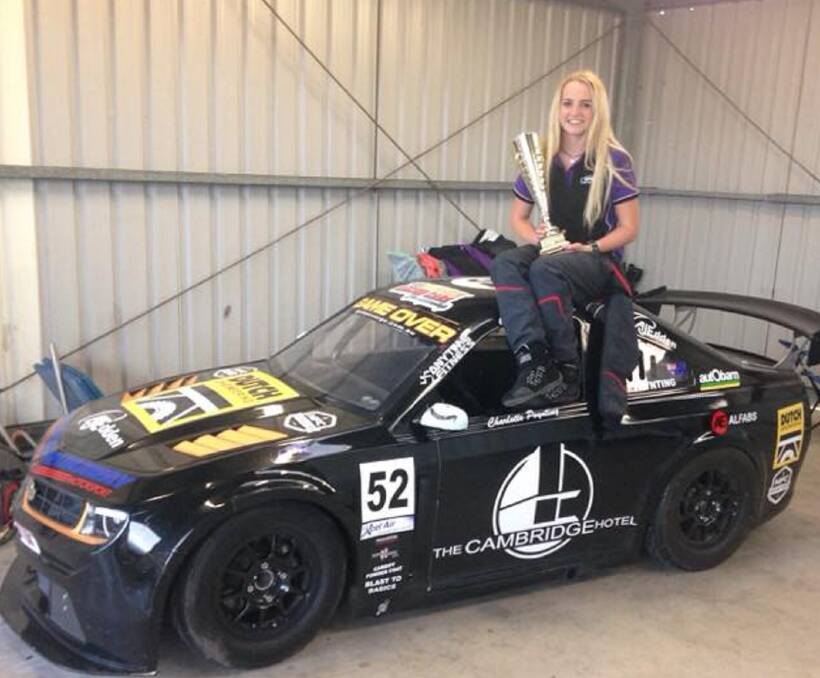 Charlotte Poynting with her trophy and the Chevrolet Camaro.