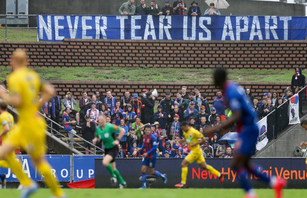 Passionate: Newcastle Jets fans watch their side take on Central Coast Mariners in October 2019. Picture: Jonathan Carroll 