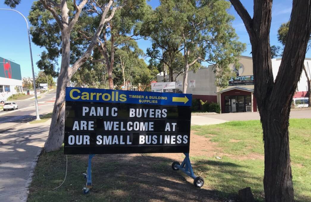 Sign of the Times: A business at Charmhaven on the Central Coast promotes the importance of shopping locally. 