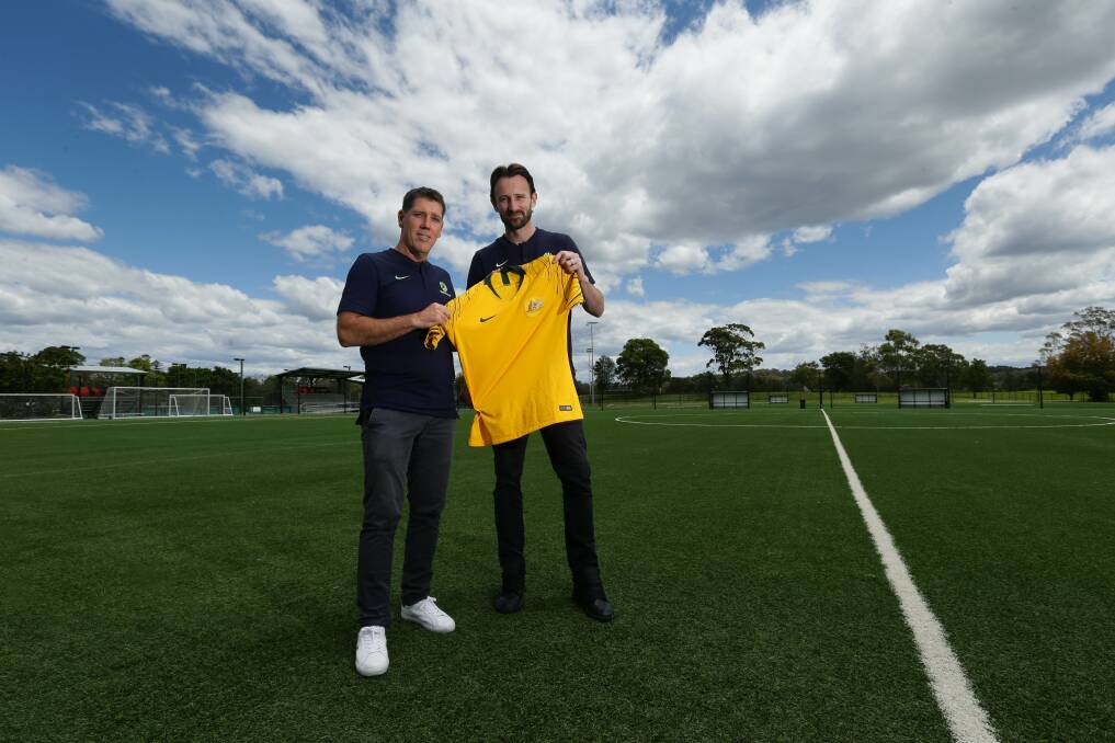 Former Socceroos Robbie Middleby and Josh Kennedy in Speers Point on Wednesday. Picture by Jonathan Carroll 