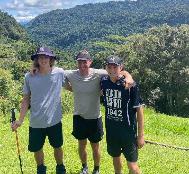 Mark Hughes on the Kokoda Track in April with sons Zac, 18, and Dane, 15. 
