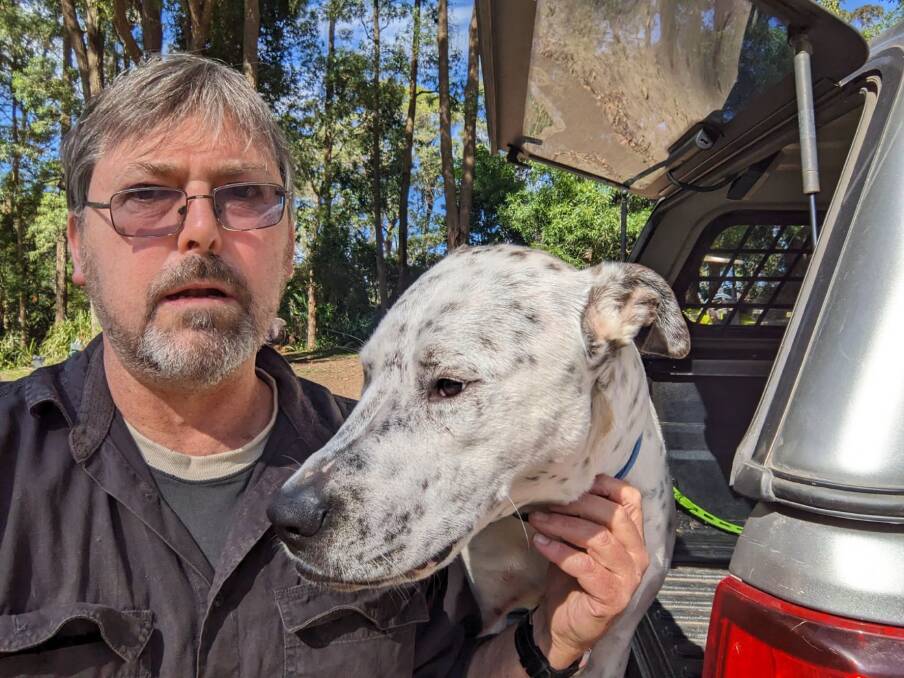 Geoff Davidson, an animal welfare advocate, with a foster dog named Shane. Picture supplied 