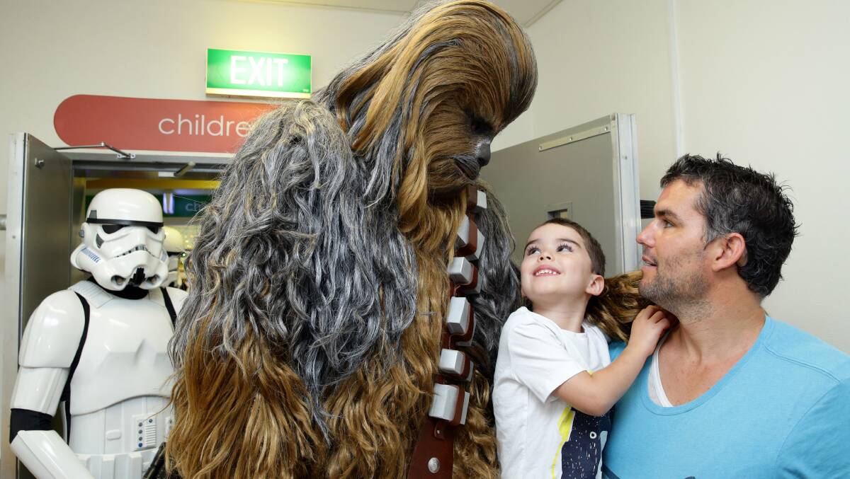 Magical Moment: Chewbacca and a stormtrooper with Blaise, 4, and Luke Murphy of Wallsend.