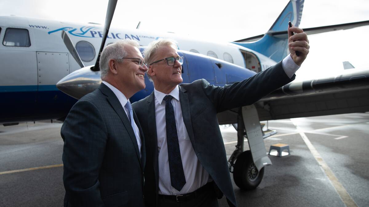 AIMING HIGH: Business Hunter chief Bob Hawes with Prime Minister Scott Morrison at Newcastle Airport in May last year. Picture: Marina Neil