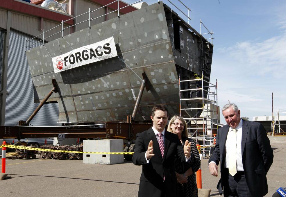 FAMILIAR STORY: Labor's Jason Clare at Forgacs, Tomago, in 2011 describing the Hunter as 'well placed' for major defence work. Picture: Darren Pateman