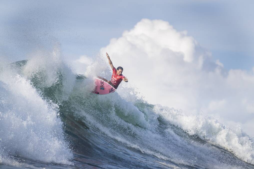 CRISP: Frenchwoman Johanne Defay belts an oncoming section at Merewether yesterday. Big move, great photo. Picture: Matt Dunbar/WSL
