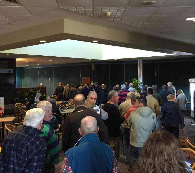VOTING AGAIN: Stockton RSL members lined up to enter the meeting that would determine the fate of their club.