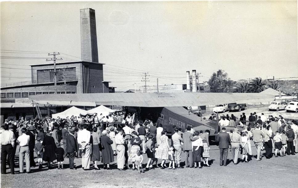 ANOTHER STACK: The Parry Street incinerator built in the 1930s can be seen in the rear of this 1950s photograph of Charles Kingsford Smith's old Fokker aircraft. Picture Bob Myles, courtesy of Greg Ray, Pictures of our Past, Newcastle Herald, October 10, 2013