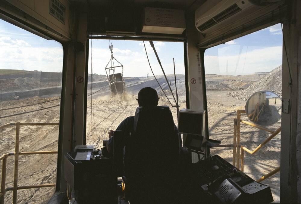 IN DEMAND: A shovel operator at the Warkworth mine, now owned by the Chinese controlled Yancoal.