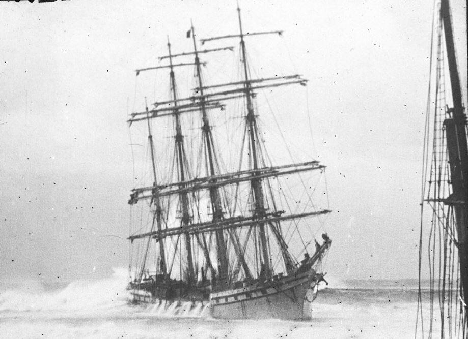 The barque Adolphe aground on the Oyster Bank in 1904. See the wall of water rising behind her, and the white spray coming off the top of the wave behind it at the bow end. Image: Hunter Living Histories, University of Newcastle