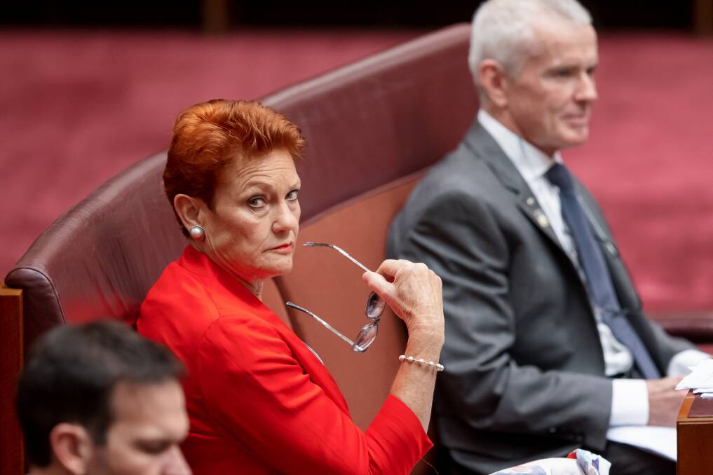 CENTRE OF ATTENTION Senators Pauline Hanson and Malcolm Roberts in parliament on Thursday. Picture: Sitthixay Ditthavong