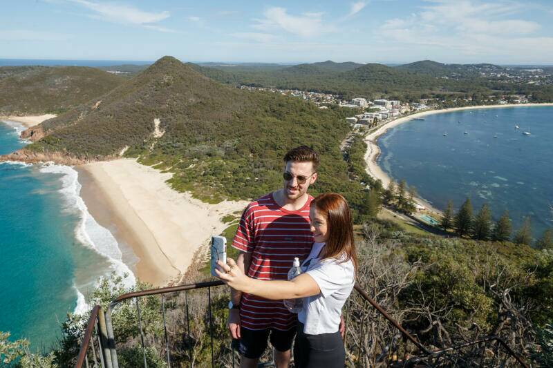 TRAVEL TIME AGAIN: Michelle McIntyre and Riley Livingstone on Tomaree headland on Wednesday. Picture: Picture Max Mason-Hubers