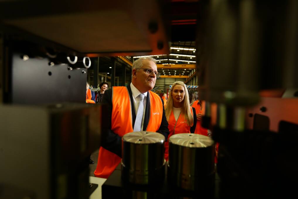 ON THE INSIDE: Prime Minister Scott Morrison with Liberal Paterson candidate Brooke Vitnell at Ampcontrol Tomago earlier this month. Picture: Jonathan Carroll