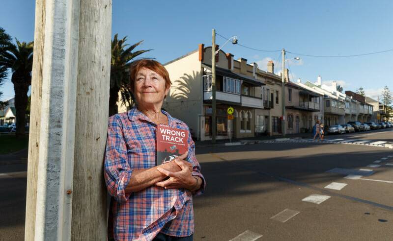 NO THROUGH ROAD: Newcastle East resident Christine Everingham, hoping that the historic streets of the East End have seen the last of Supercars. She holds a copy of Wrong Track, the book she co-wrote with former Newcastle Greens councillor Therese Doyle, arguing that 'accountability, transparency and genuine consultation' have been 'cynically swept aside' in favour of Supercars. Picture: Max Mason-Hubers
