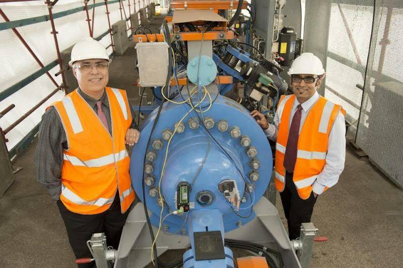  Professor Behdad Moghtaderi (left) and Dr Kalpit Shah with an earlier University of Newcastle project, involving "waste to power" technology. 