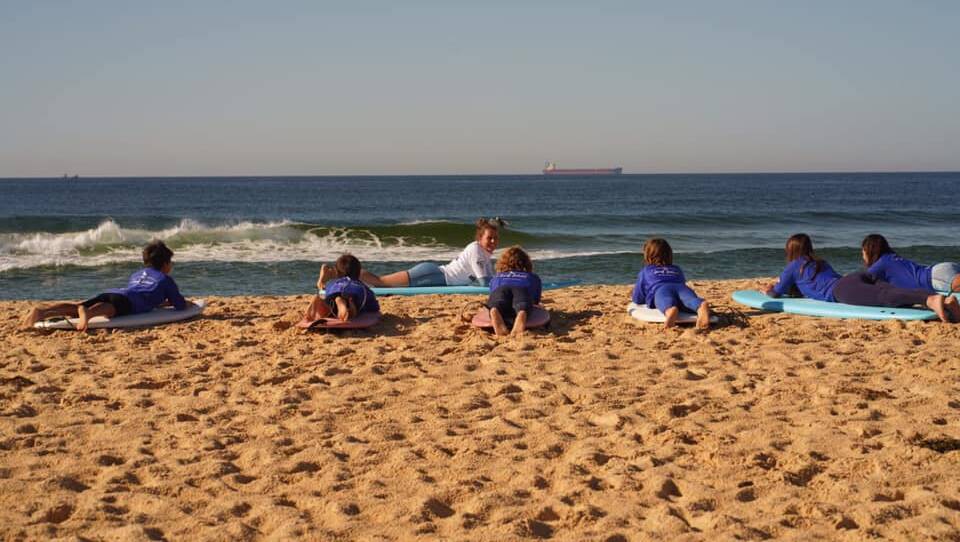 COASTAL COACHING: Philippa Anderson on the beach at Nobbys. Picture: Courtesy Philippa Anderson Surf School